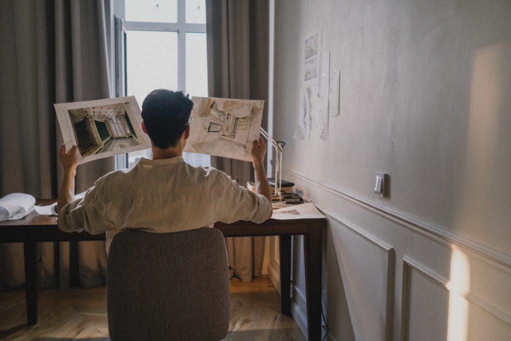 Male sitting a desk designing